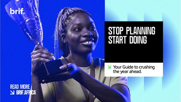 An African Lady Holding a Troph